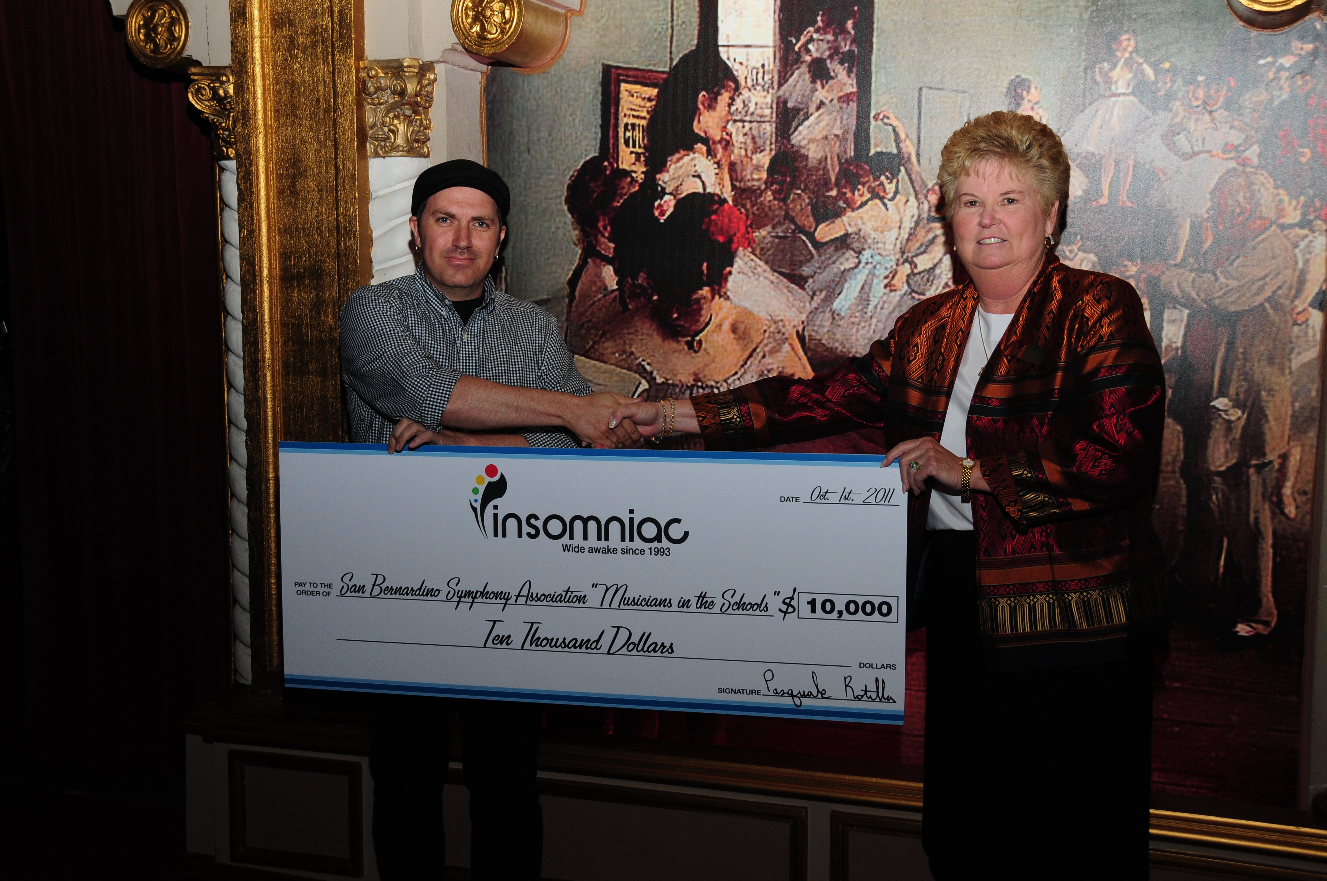 Insomniac CEO Presents Check